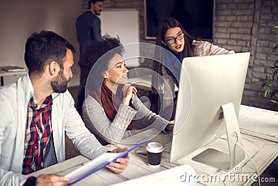 Young people working together in designerâ€™s office Stock Photo